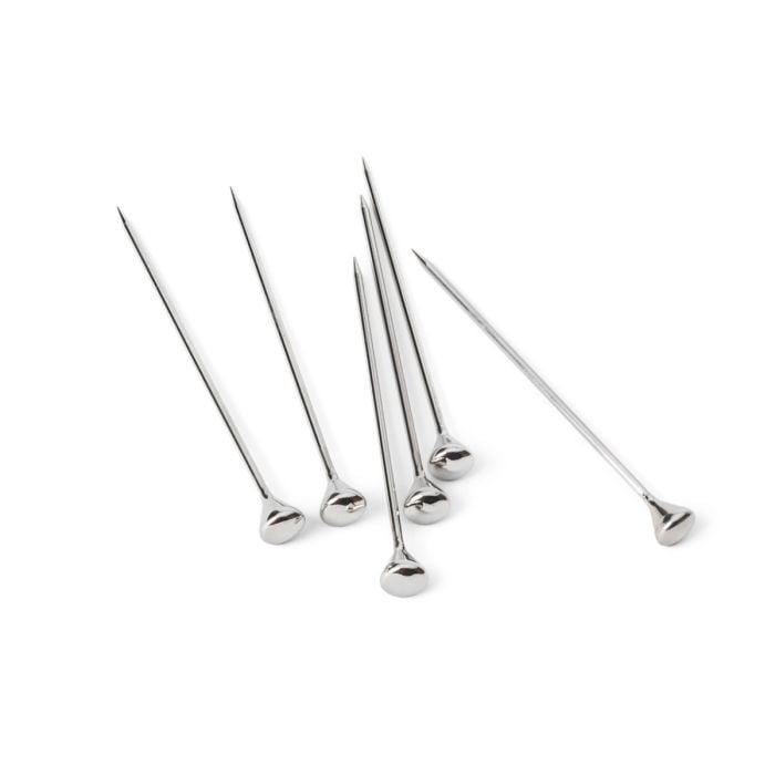 Six stainless steel cocktail picks with spherical handles arranged in a group.