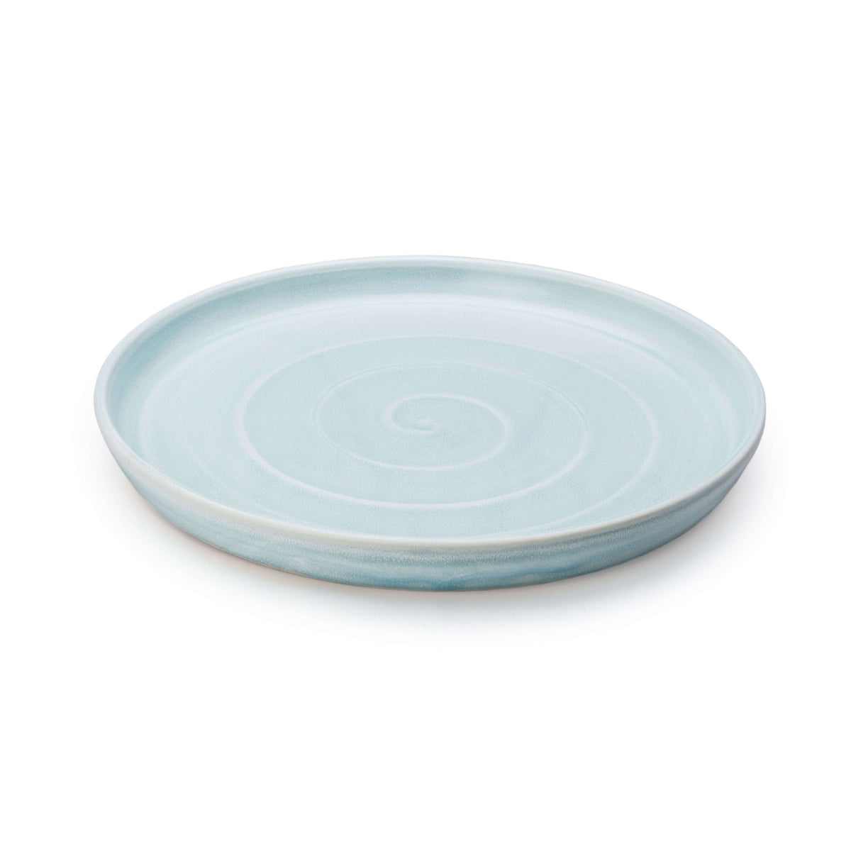 Light blue ceramic plate with concentric circle pattern and shallow rim.