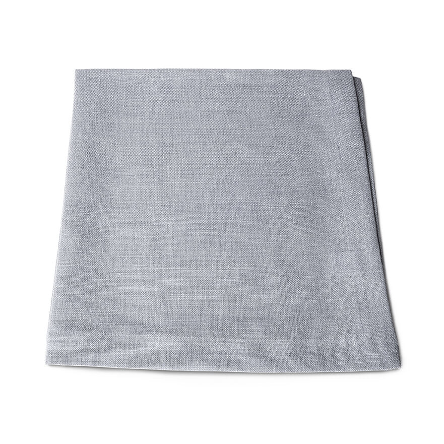 Four light gray linen napkins stacked and folded.