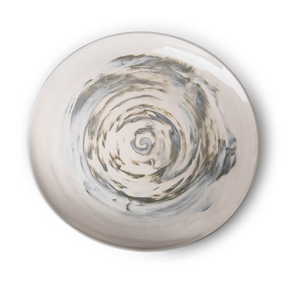 Round ceramic platter with cream and gray spiral design in center.