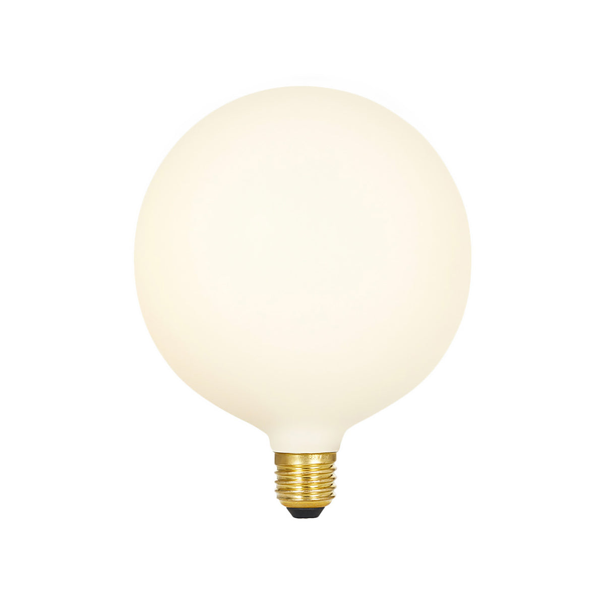 Spherical matte cream porcelain LED bulb with brass base and black contact point.