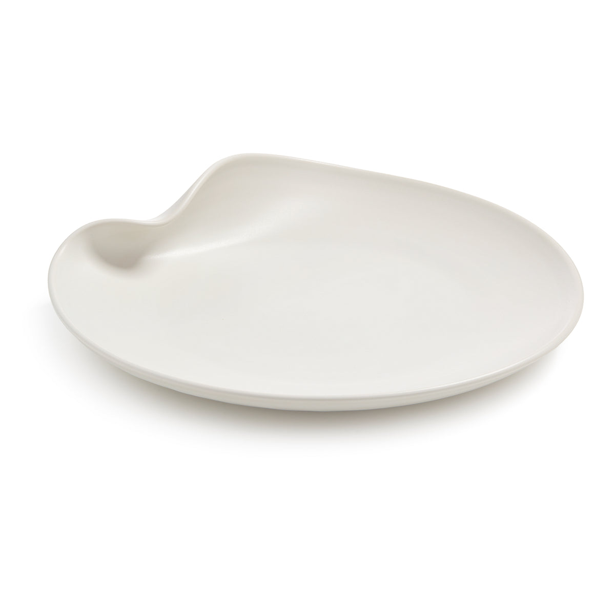 White ceramic platter with organic curved shape and small handle indent on one side.