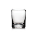 Empty clear glass whiskey tumbler with thick base and weighted bottom on white background.