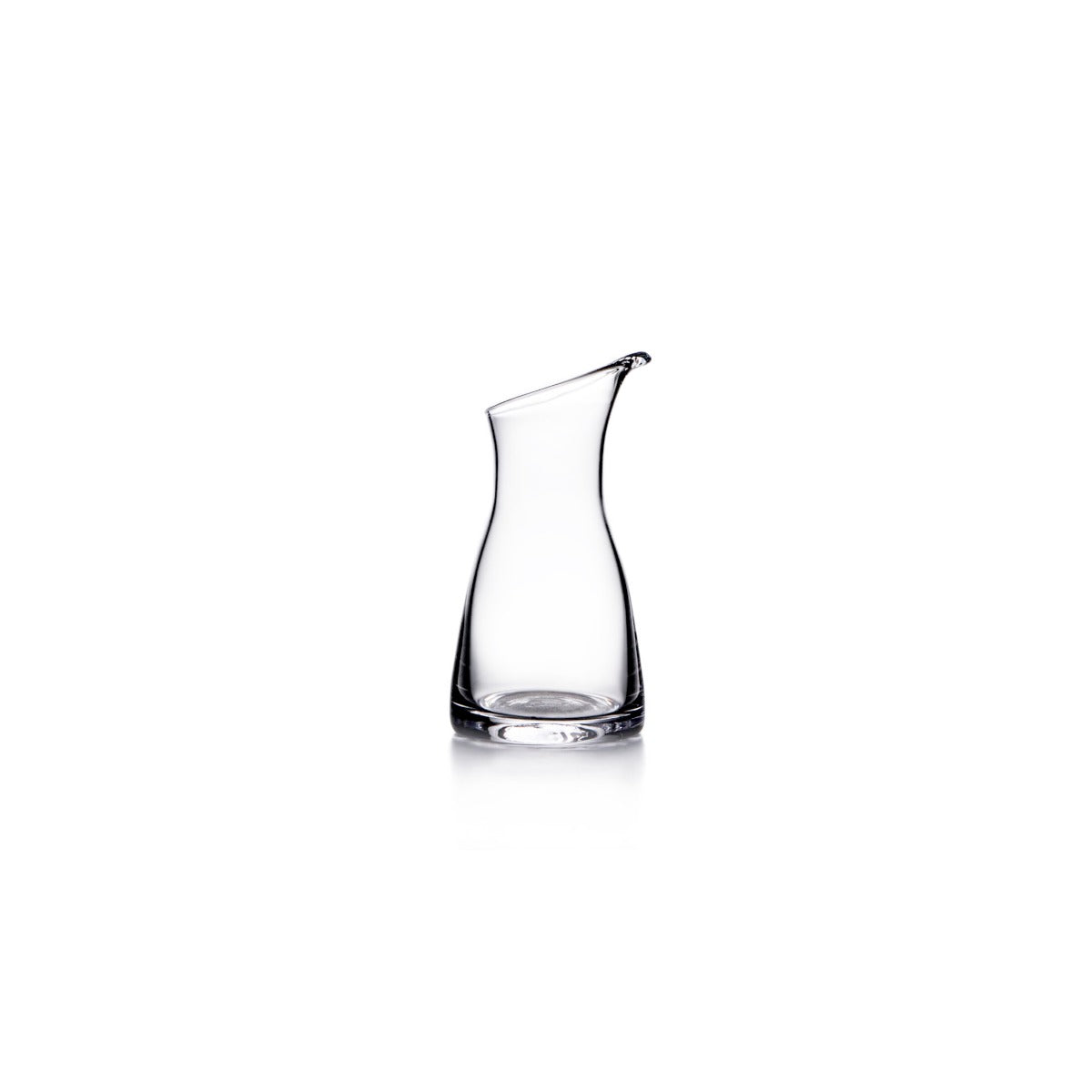 Clear glass carafe with curved sides and a spout at the top.