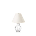 Small table lamp with clear glass spherical base and cream linen shade.