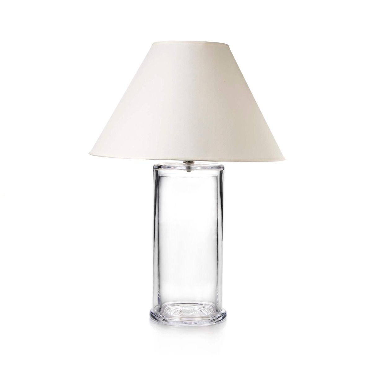 Clear glass cylindrical lamp base with cream-colored fabric shade.