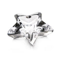 Clear glass star-shaped paperweight with pointed edges and a smooth, polished finish.