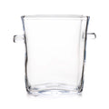 Clear glass ice bucket with two handles on sides and slightly tapered cylindrical shape.