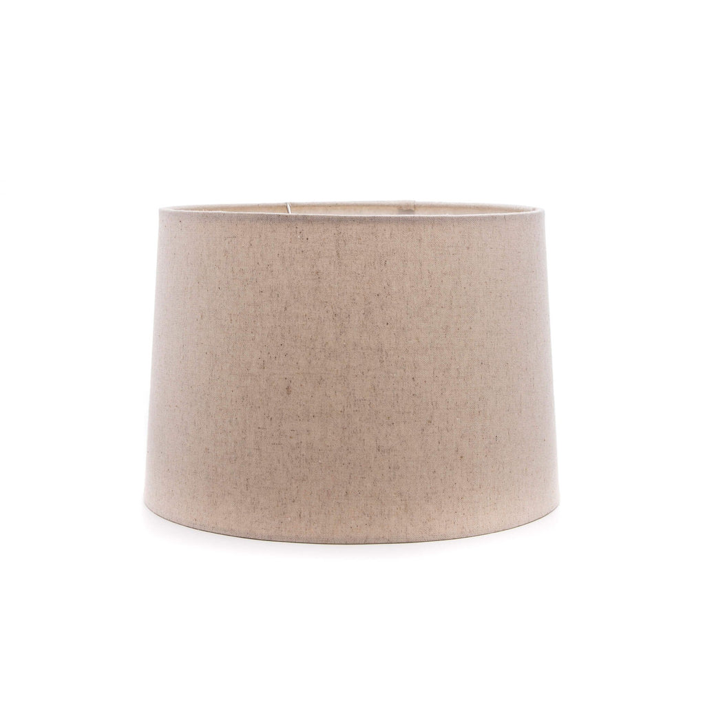 Cylindrical linen lamp shade in natural beige with textured fabric and straight sides.