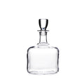 Clear glass decanter with a rounded base, tapered neck, and glass stopper.