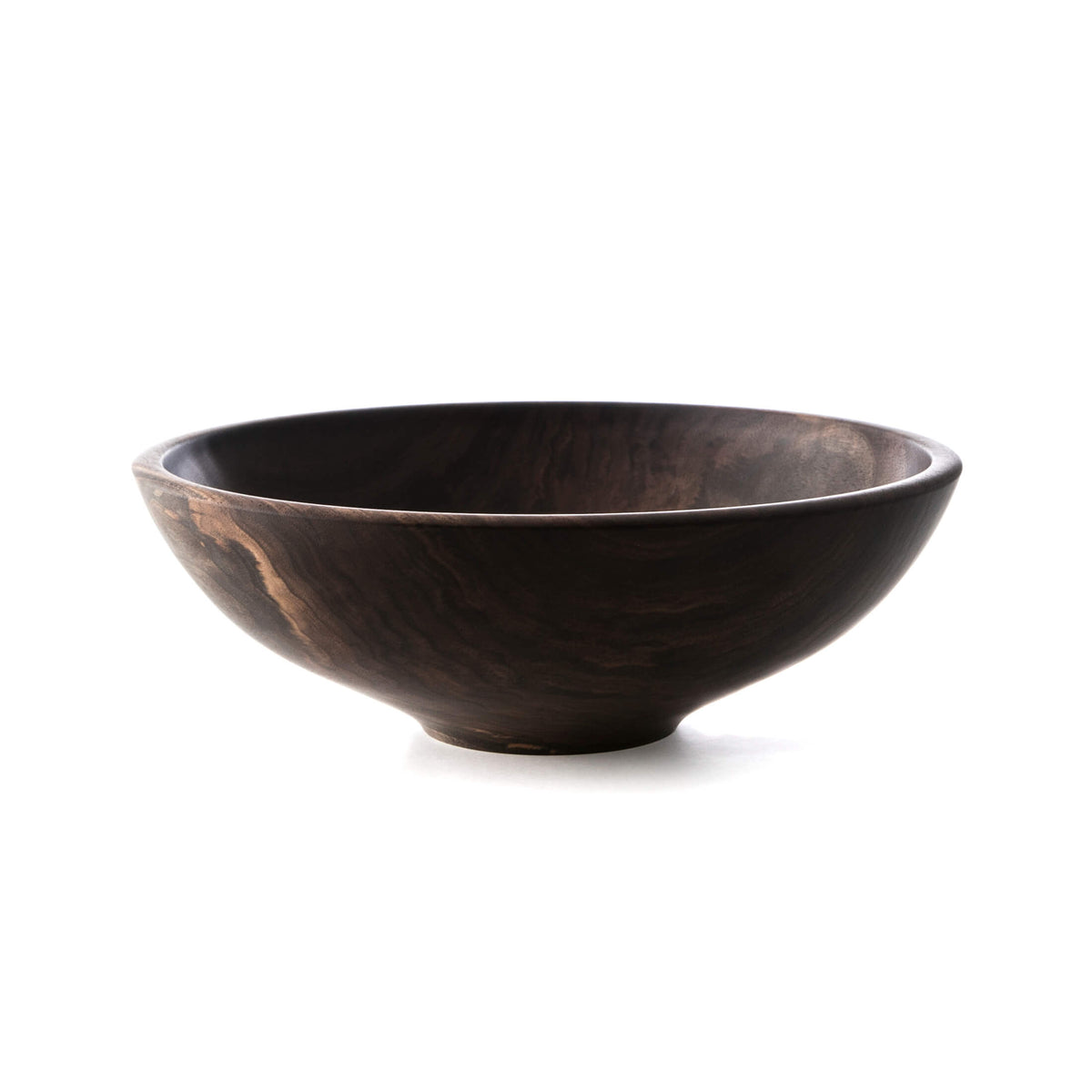 Dark wood bowl with a wide, curved rim and smooth interior, showing natural grain patterns and variations in tone.