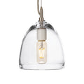 Clear glass dome pendant with brushed metal fixture and visible filament bulb suspended by rope cord.