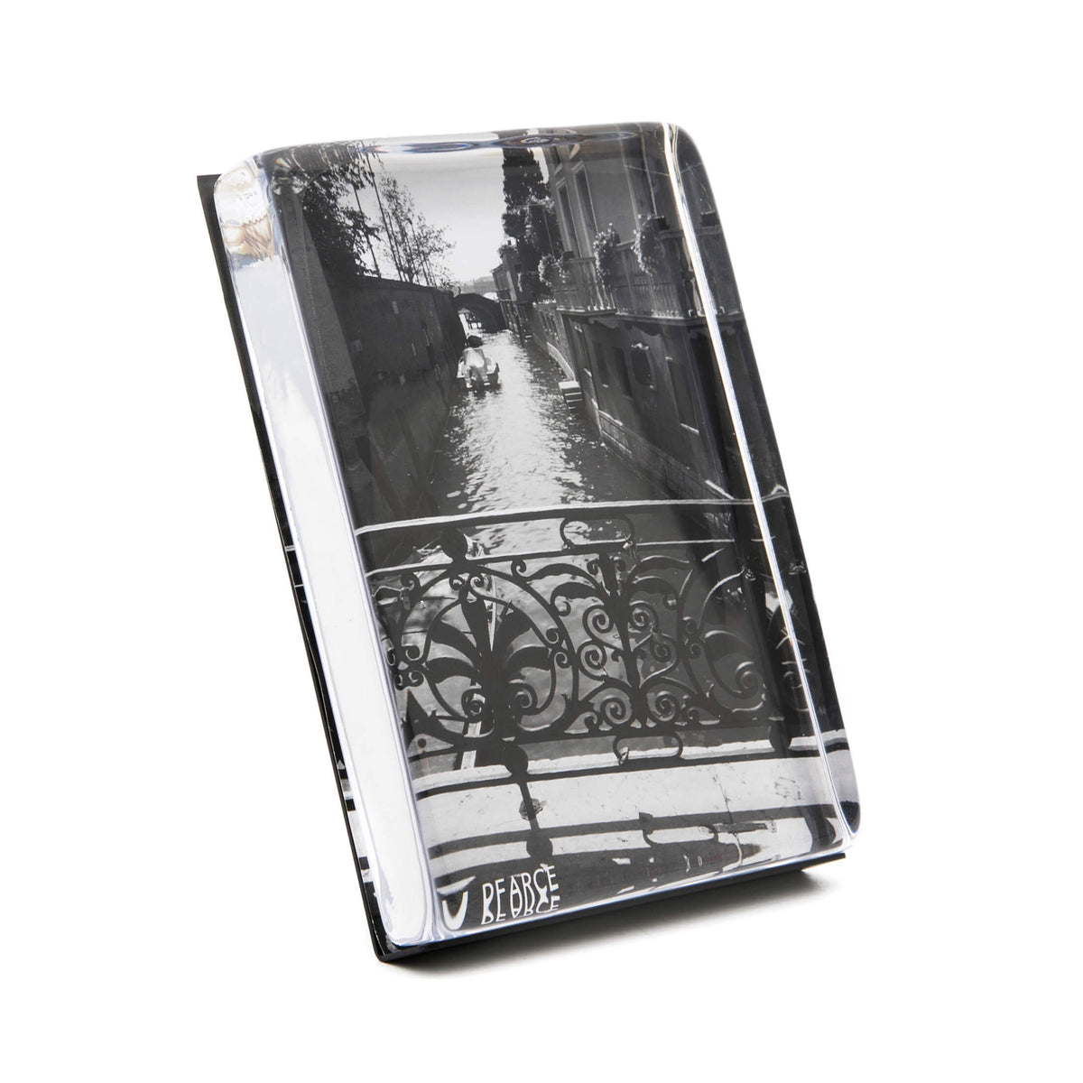 Vertical acrylic photo block with black and white canal scene and ornate railing detail.