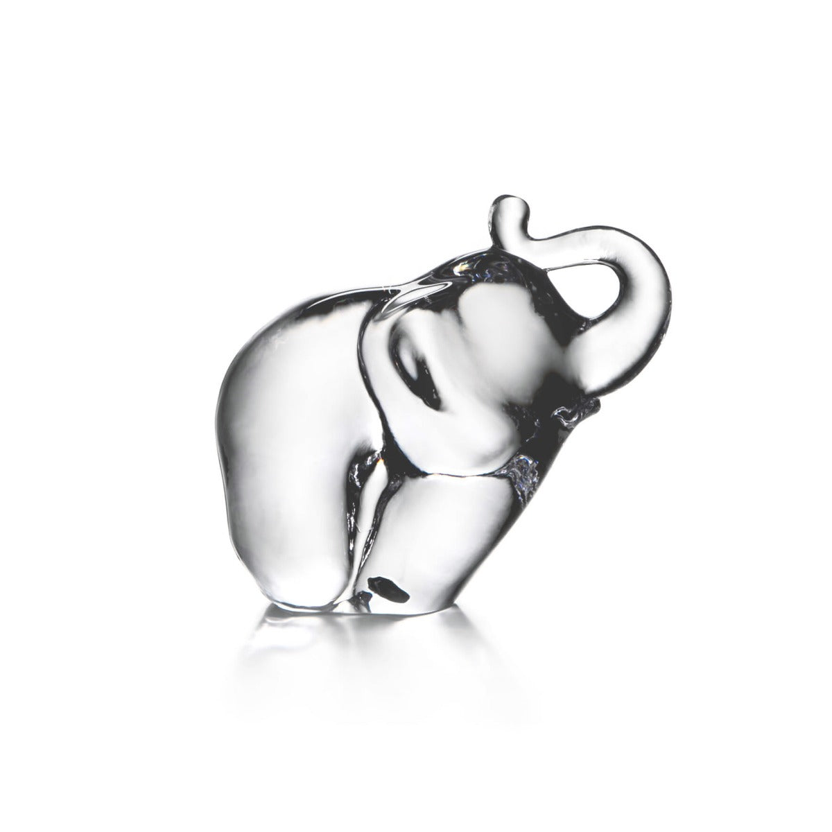 Clear glass elephant figurine with raised trunk and decorative saddle blanket detail.