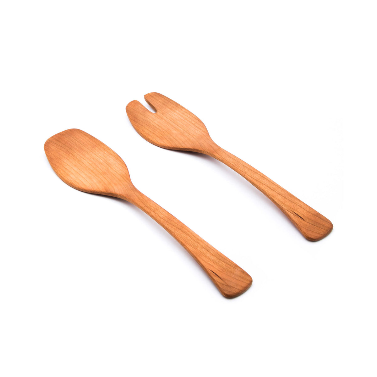 Pair of wooden salad servers with cherry-colored finish and slotted, spoon-like heads.