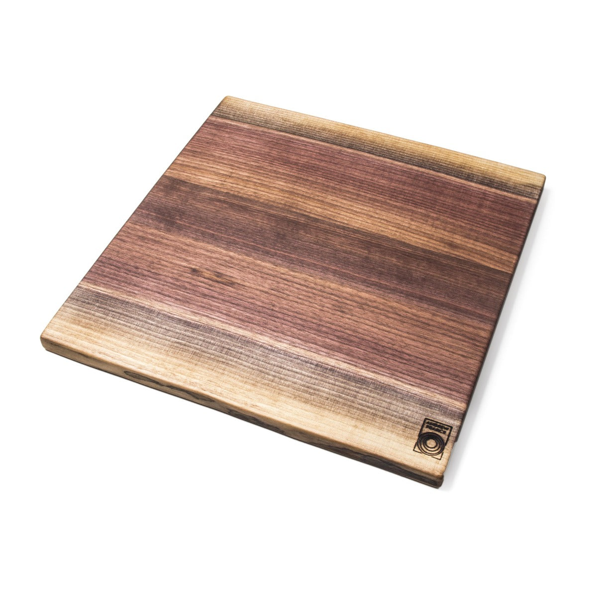 Black walnut cutting board with live edges on two sides and natural wood grain variation throughout.
