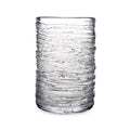 Clear glass tumbler with horizontal textured ridges throughout the cylindrical body.