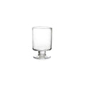 Clear glass hurricane-style votive holder with pedestal base and cylindrical body.