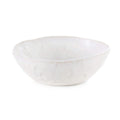 White cereal bowl with wavy rim and cloud-like surface texture.