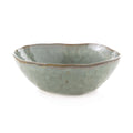 Moss green cereal bowl with wavy rim and speckled glaze finish.
