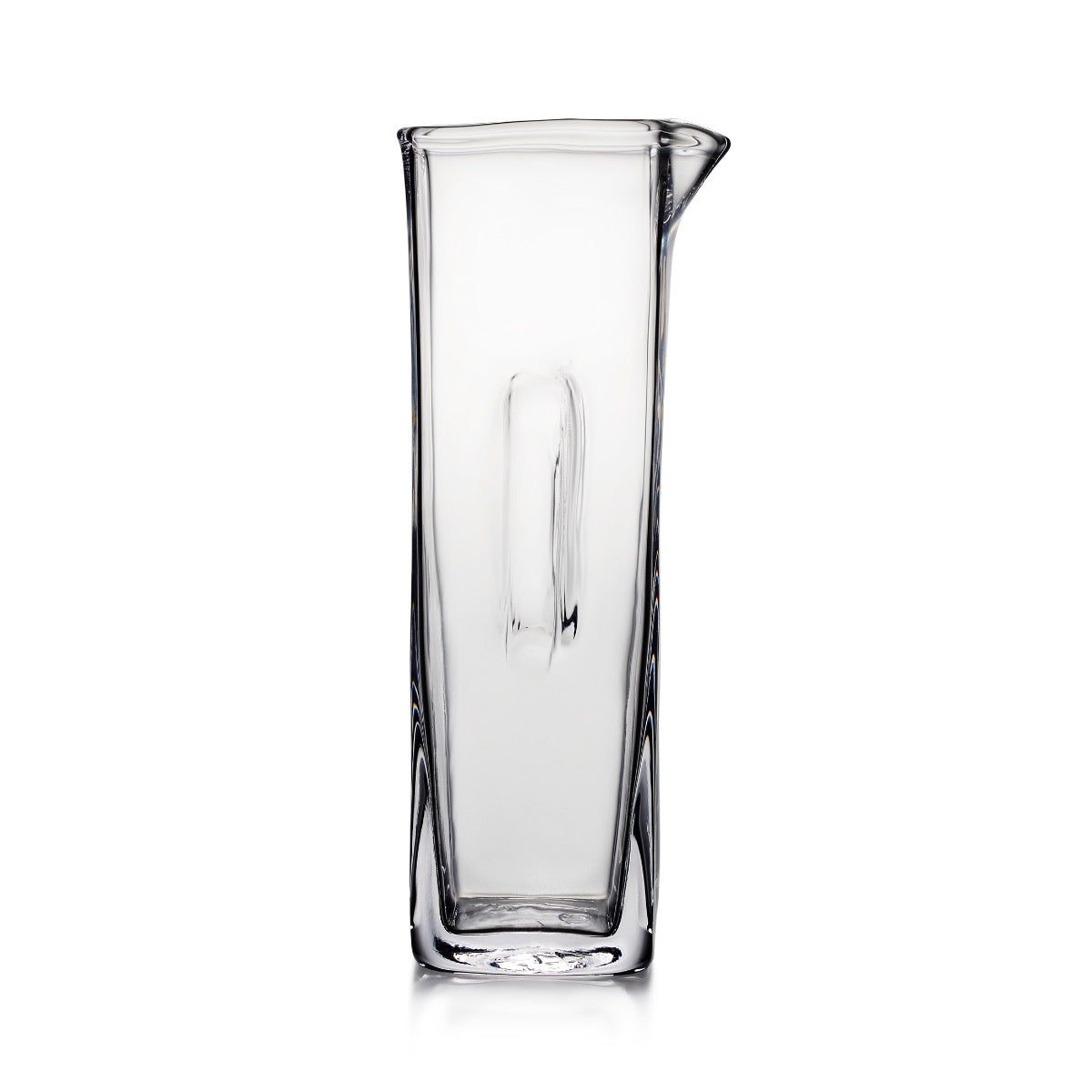 Clear glass carafe with tapered cylindrical body and pouring spout on upper right side.