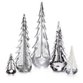 Five decorative glass tree sculptures in varying sizes with pointed tops and textured surfaces in silver and clear finishes.