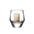 Clear glass hurricane vase with cream pillar candle inside.