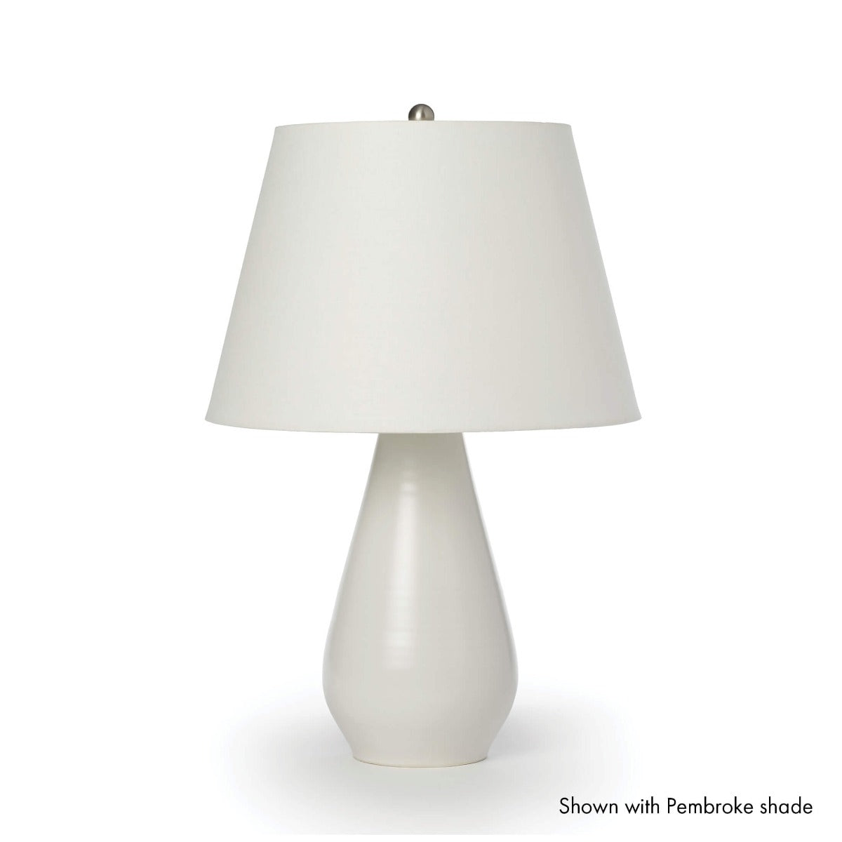 Cream pottery table lamp with tapered base and cream linen shade.