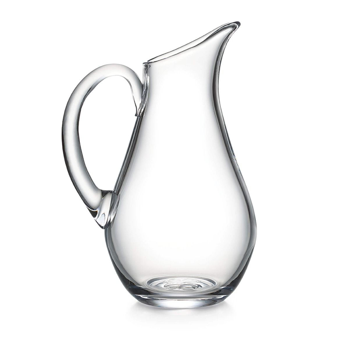 Clear glass pitcher with curved body, angled spout, and thick handle.