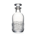 Clear glass decanter with textured lower body and matching stopper.