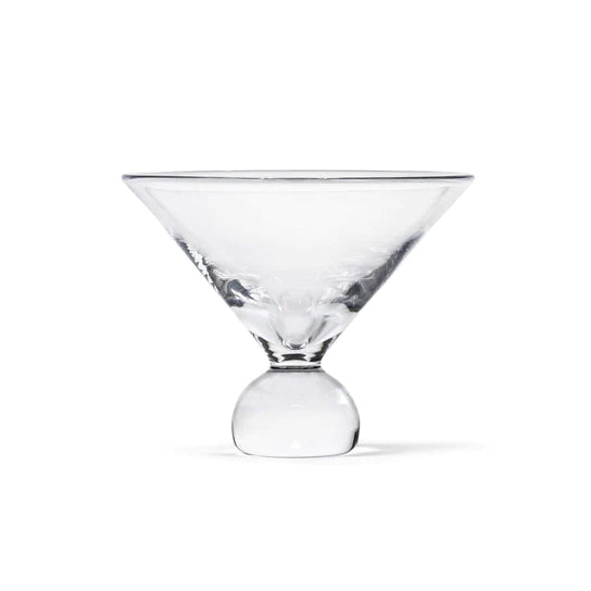Clear martini glass with wide triangular bowl and bulbous stem base on white background.