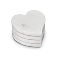 Four white marble heart-shaped coasters stacked together with visible veining throughout.