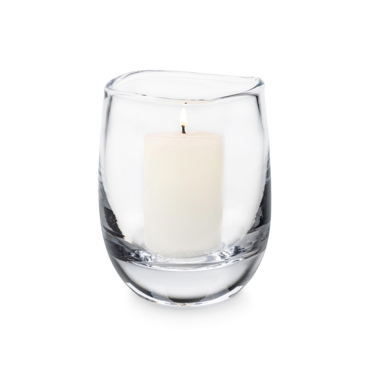 Clear glass hurricane vase with cream-colored pillar candle inside.