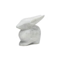 White marble rabbit sculpture with pointed ears and smooth, polished surface.