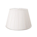 White pleated linen lamp shade with tapered cylindrical shape and vertical fold details.