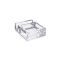 Clear acrylic phone valet with metal tray and handle for organizing personal items.
