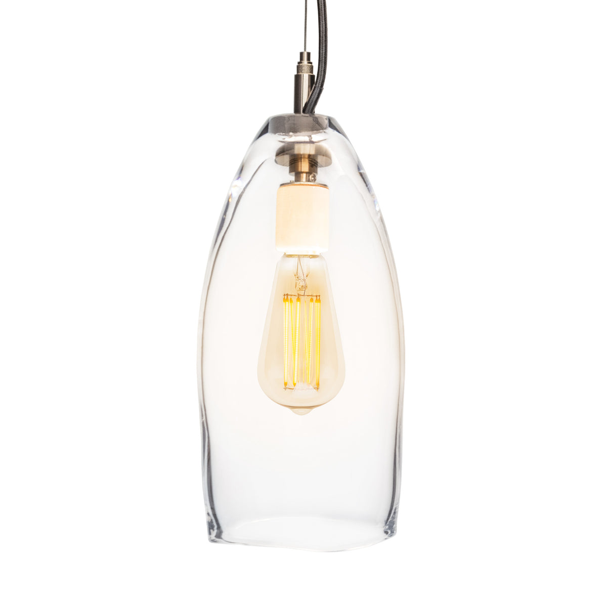 Clear glass pendant light with brushed metal fixture and exposed filament bulb suspended by dark cord.