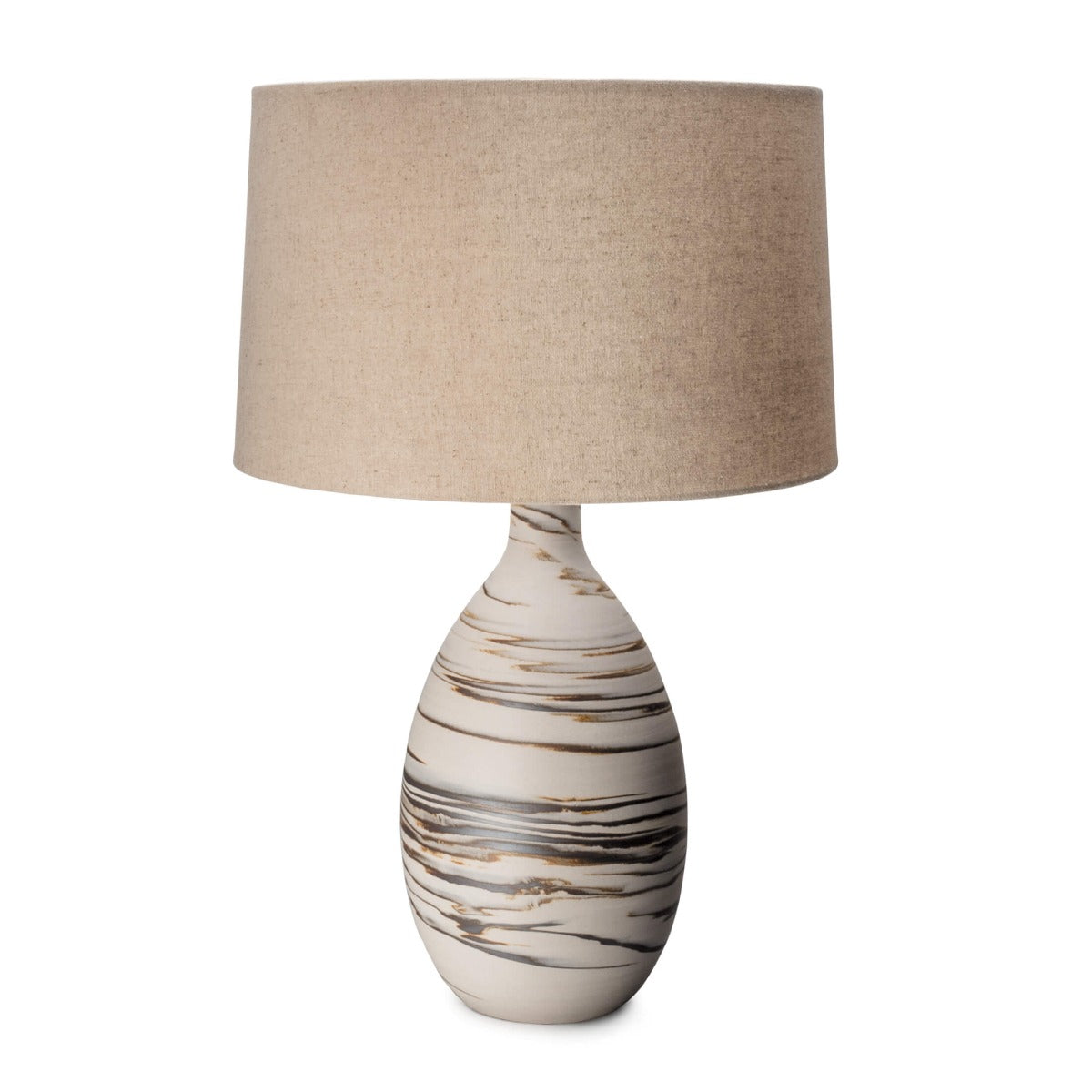 Tall table lamp with cream ceramic base featuring brown striped pattern and beige linen drum shade.