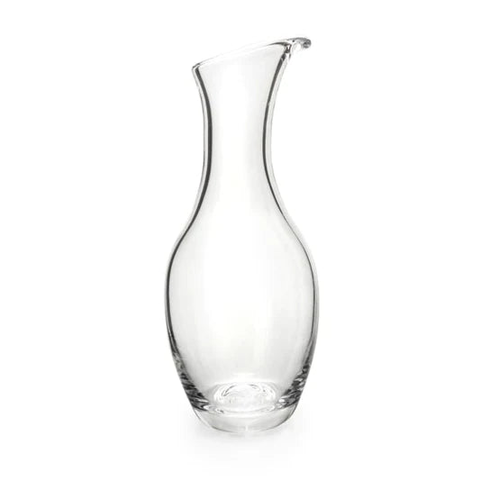 Clear glass carafe with curved sides and a pouring spout at the top.