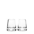 Two empty clear glass tumblers with thick bases side by side.