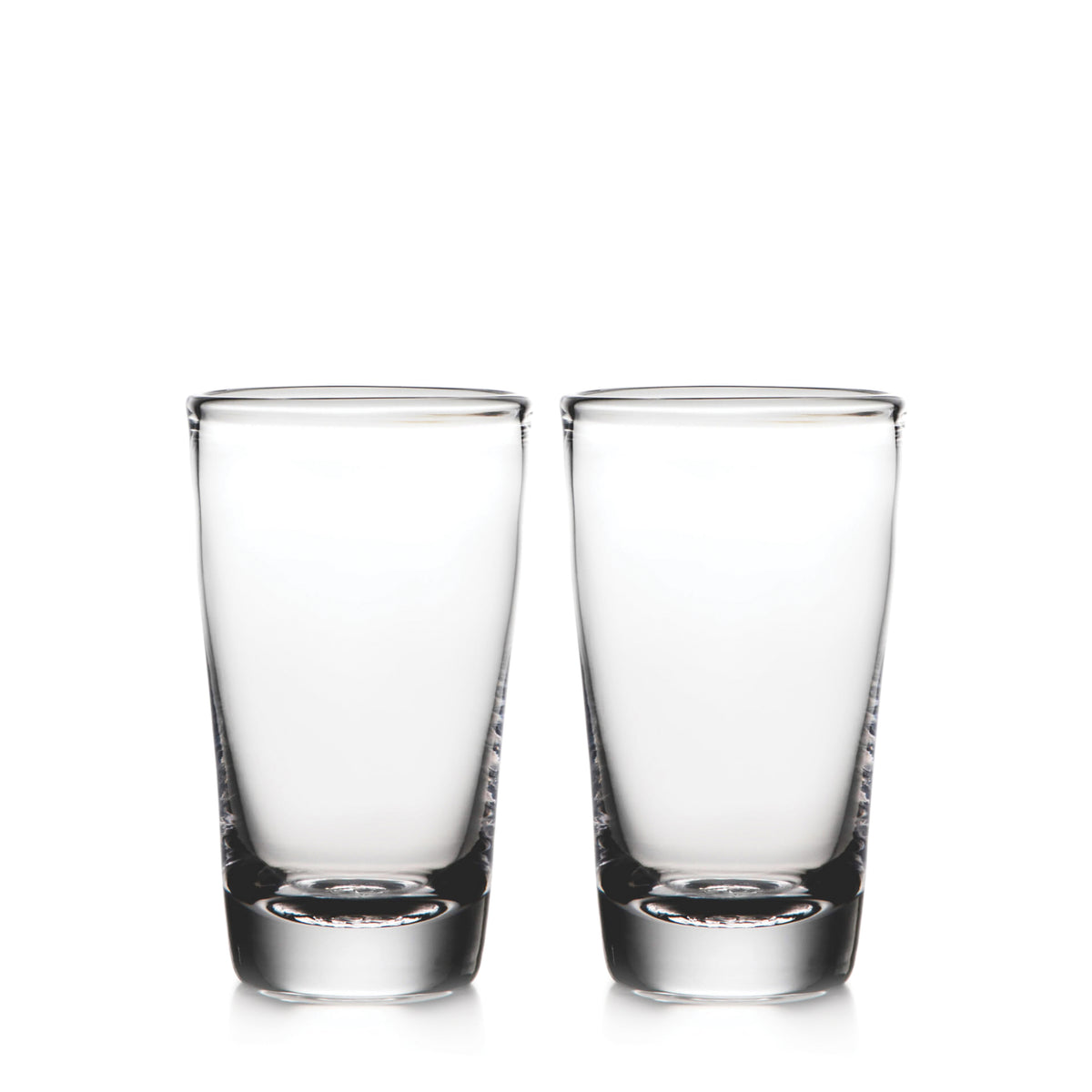 Two clear pint glasses with thick bases side by side.