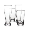 Four clear glass beer glasses in varying heights with weighted bases arranged in a group.