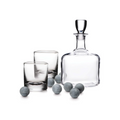 Glass decanter with stopper, two rocks glasses, and six gray whiskey stones.