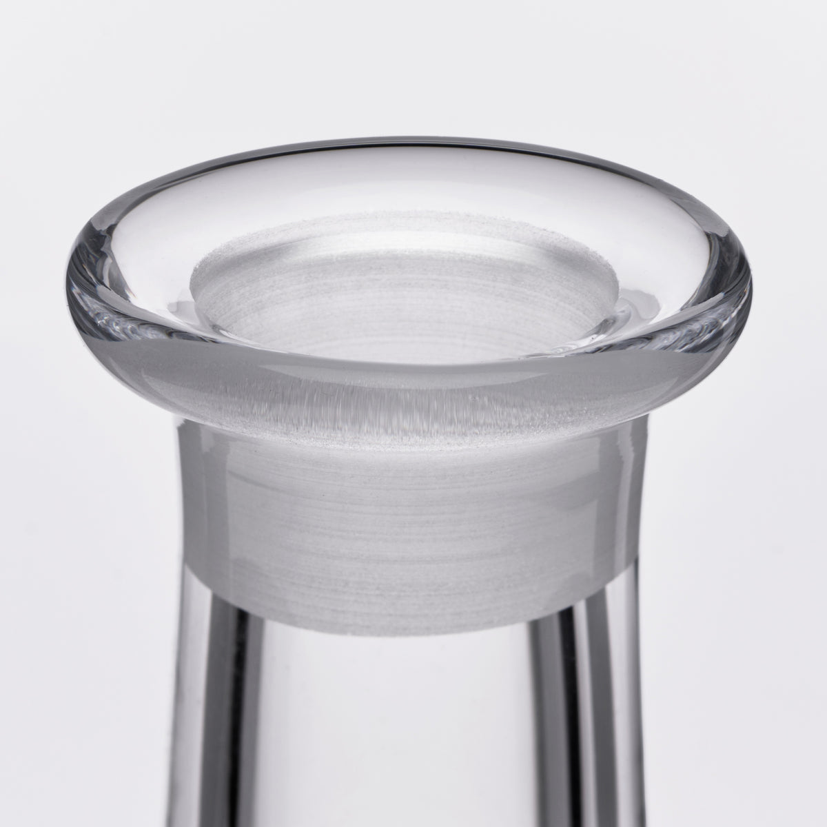 Clear glass decanter with wide flared rim and frosted band detail around the neck.