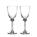 Two clear wine glasses with long stems and rounded bowls on white background.