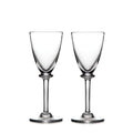 Two clear glass wine glasses with tapered bowls and stem bases on white background.