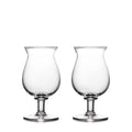 Two clear glass tulip-shaped stemmed glasses with rounded bowls and pedestal bases.
