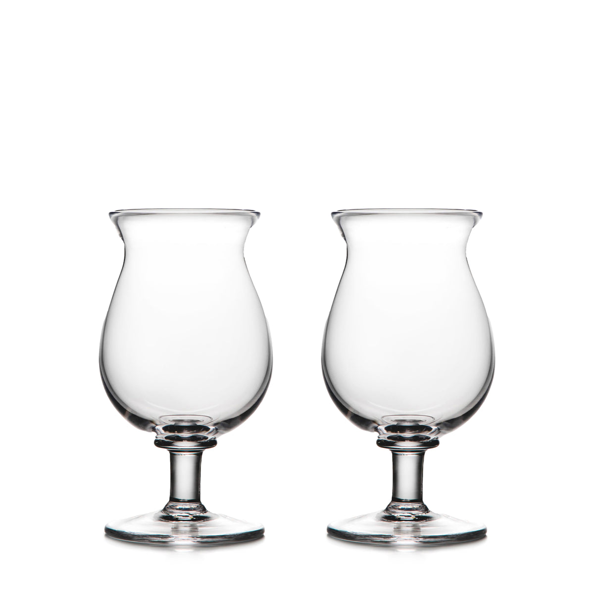 Two clear glass tulip-shaped stemmed glasses with rounded bowls and pedestal bases.