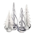 Four glass tree figurines with frosted white and clear glass in varying heights with dark gray striped details.