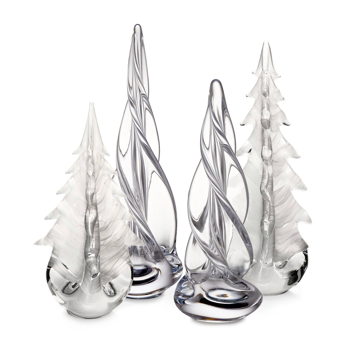 Four glass tree figurines with frosted white and clear glass in varying heights with dark gray striped details.